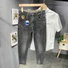 Jeans masculinos designer verão fino versátil china-chique impresso marca de moda elástica slim fit pés pequenos calças de perna reta para homens 7ovi