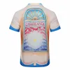 Casa Designer Modekläder Skjortor Träningsoveraller 2023 Nya Casablanca Red Blue Sea Sunrise Kortärmad skjorta Herr Damer Set Shirt