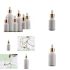 Förpackningsflaskor 10 ml 20 ml 30 ml 50 ml 100 ml elegant vitt porslin kosmetiskt glas eteriskt olje dropper med öga för e vätskedroppe de dhb3j