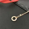 Nunca se desvanece plateado Diseñador de la marca de lujo Colgantes Collares Anillo doble de acero inoxidable con diamante Colgante Collar Cuentas Cadena Joyería Accesorios Regalos