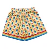 Casa Designer Kort Mode Vrijetijdskleding Strandshorts Casablanca 23ss Dream Gate Heren Dames Liefhebbers Dezelfde stijl Witte Twill Zijden Short Capri Losse pasvorm