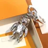 Дизайнер -дизайнер для ключей клавиши роскошной клавиши Metal Sense Design Design Humanoid Fashion Casual Style Key Chain универсальный популярный корпус телефона для подвесной сумки очень Goodz0pd