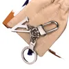 مصمم المفاتيح العلامة التجارية الفاخرة Keyring حرف كلاسيكي سلسلة مفاتيح الأزياء Women Bag Charm Men Car Carchains حلقة مفتاح محمولة