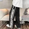 Damskie spodnie dwuczęściowe Ulica Harajuku Luźne spodnie Mężczyźni Kobiety Casual Sport Boczne rozcięcia Przyciski Retro Stripe Jogging Estetyczne spodnie z szerokimi nogawkami Y2k 230703