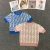 Mode stickad kjoldräkt designer spårdräkter kvinnor kort ärm t-shirt tryckt brev tee veet miniskirt tvådelar