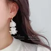 Boucles d'oreilles à tige perle de riz tricot à la main mode Globus multi-étages perlé Simple bohême alliage circulaire madame frange