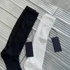 Kadınlar SOCKS Pamuk İçi Boş Orta Tüp Kadın Çorapları Örme Üçgen Lable Dekorasyon Moda Tasarım Buzağı