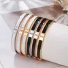 Brazalete esmaltado negro blanco popular, joyería para mujer, regalo