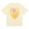 Camisetas de grife com padrão de alfabeto de escudo estampado algodão puro solto casual masculino e feminino camiseta de manga curta