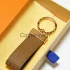 Schlüsselanhänger Designer Schlüsselanhänger Klassische Exquisite Auto Mode Schlüsselanhänger Zinklegierung Brief Unisex Lanyard Gold Schwarz Metall Kleiner Schmuck Liebhaber Pend J230706