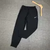 Calça de moletom masculina verão respirável solta confortável marca tendência esportes de corrida plus size calça de moletom solta