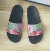 Designerskie sandały wsuwane płaskie obcasy klapki plażowe czarne tygrysie kwiatowe sandały zielone modne luksusowe letnie klapki damskie męskie trampki 35-45