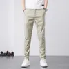 Pantalones de hombre 2023 verano caqui acogedor algodón Casual hombres fino recto ajuste moda marca ropa Color sólido apliques pantalones masculinos