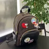 Cartoon Towel Sticker Composite Mini Pack Designer Classic Backpack High Quality Casual Working Leather Shoulders Coac Track Bags Totes Belt Strap Bag Size 26x31cm