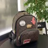 Etiqueta engomada de la toalla de lujo Mini paquete compuesto Mochila clásica de diseñador Hombros de cuero de trabajo informales de alta calidad Bolsos de pista Coac Totes Cinturón Correa Tamaño del bolso 26x31cm