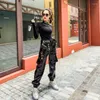 Pantalon femme rue Punk Faux cuir Biker femmes personnalité coupe ample poches taille haute Cargo femme mode pantalon