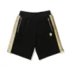 A Bathing A Ape Trendy men's gold embroidered casual shorts