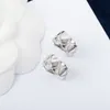 2023 Boucle d'oreille clip de luxe de qualité avec diamant et sans plaqué en deux couleurs avec tampon en forme de losange PS7275B