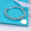 Counter quality tiffay Love Peach Heart Bracciale Femmina CNC Word Print Hangtag a forma di inglese 8mm Buddha Bead Ball Handstring con logo