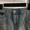 23SS Дизайнерские юбки Женская одежда Треугольная этикетка с A-линейной джинсовой джинсовой шорт-юбки.