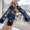 High quality black and white Soldier keychain Cartoon PVC couple bag Exquisite car key chain hanging ornaments