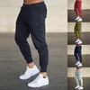 Męskie spodnie Jogging mężczyźni sportowe spodnie dresowe biegające joggery bawełniane dresy szczupłe kulturystyka spodni 2307706