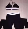 Costume da yoga di design Set di bikini con ricamo sexy in tessuto Set di bikini con lettere di marca Costumi da bagno di design con catena in metallo Costume da bagno diviso senza schienale da donna di alta qualità