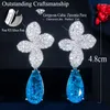 Pendientes colgantes ThreeGraces Unique Light Blue Cubic Zirconia Flor grande que cuelga Pendiente de gota de agua para mujeres Summer Wedding Party Jewelry