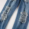 Jeans da uomo strappati azzurri streetwear moda in difficoltà skinny elasticizzati toppe a coste distrutte