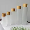 Bouteilles De Stockage En Gros Logo Personnalisé Cosmétique Verre Dépoli Vaporisateur Maquillage Grain De Bois Bambou Cap Emulsion Pompe Conteneur Emballage