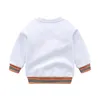 T-shirt arrivo Autunno moda Inghilterra Stile bambini vestiti ragazzi ragazze a maniche lunghe in cotone plaid t-shirt top coat 230707