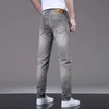 Mens jeans ontwerper 2023 lente/zomer dunne fit kleine voeten elastische casual trend Koreaanse editie high -end as broek QDL4