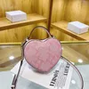 Väskor Desinger hjärtaformade mini söta axel kvinnor co handbag vintage molnt läder rosa crossbody väska