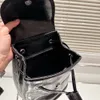 2023 hochwertiger Kristall-Rindsleder-Rucksack für Damen, schwarz, kleines Fassungsvermögen, Metall-Schultergurt, Flip-Pull-Kordel-Öffnung, klassisch, lässig, Designer-Modemarke