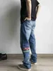 Jeans de deuxième génération de longévité usés et épissés fleur de cajou 501 pantalons décontractés brodés avec patch cassé Niuwang