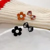 Bowknot asimmetrico del fiore degli orecchini della vite prigioniera per il regalo all'ingrosso dei monili di modo della festa nuziale del tessuto del metallo sveglio coreano delle donne
