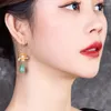 Boucles d'oreilles pendantes fleur dorée nationale chinoise floraison heureuse Beizhu avec tempérament frais Dongling Jade