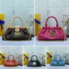 Monogramas de designer Bolsas de embreagem Bolsas de luxuros femininas com cadeia Saco de clasco rebitado em cadeia