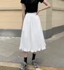 Spódnice letnie kobiety biały czarny styl japoński miękka dziewczyna estetyczna wysoka talia linia Kawaii plisowany brzeg wzburzyć długa spódnica trzy czwarte