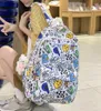 School Bags Kawaii nylon backpack cartoon printed shoulder bag cute doll pendant Rucksack large capacity lightweight unisex student bag 230712