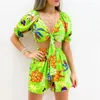 Träningsoveraller för kvinnor Kvinnor Playsuit Blommönster Kortärmad Uppfällbar krage Bandage Lösa Playsuits Mode Romper Sommar Beachwear Outfit