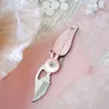 Schlüsselanhänger Mini-Messer-Klappmesser-Schlüsselanhänger Outdoor-Rettungs-Klappfeder Tragbare Taschen-Survive-Schlüsselanhänger
