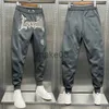 Spodnie męskie y2k litery haftowane spodnie szerokie nogawki męskie highend koreański para casual spodnie sportowe allmatch moda elastyczne spodnie gorąca sprzedaż J230712