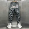 Pantaloni da uomo y2k lettere ricamate pantaloni larghi da uomo coppia coreana di fascia alta pantaloni sportivi casual allmatch moda pantaloni elastici vendita calda J230712