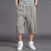 Męskie spodnie Bezpieczna kieszeń Spodenki sportowe Oddychająca długość do połowy łydki Lato Przycięte z elastyczną talią Wiele kieszeni dla sportu