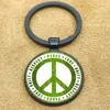 Keychains Logo de guerre anti-nucléaire Key Chain International Peace Day Journchain contre et aspirant à Ring Glass Cabochon