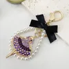 Portachiavi Gioielli di lusso Perle d'imitazione Danza Catena con fiocco in cristallo Portachiavi Supporto per auto Ciondolo borsa per regalo ragazza femminile Portachiavi Trinket