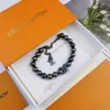 Designer Black Monogram Pearls Armband M01157