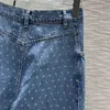 Dżinsowe marka logo drukowane faluje wydrukowane dżinsowe dżinsowe spodni importowane tkaniny nieregularne cięte spodnie w stylu retro designerskie dżinsy ubrania damskie