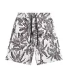 Shorts masculinos 2023 verão shorts masculinos designer de calças de praia de luxo versão calças curtas moda casual impressão de flores patchwork malha calções de banho x0713 x07